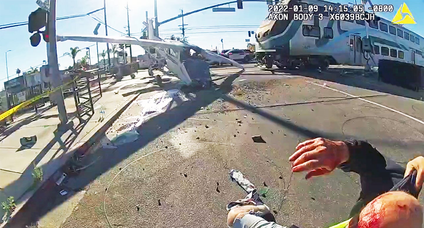 *INTENSE VIDEO: Police pull pilot from crashed plane on railroad tracks seconds before train smashes into it - Nine Line Apparel