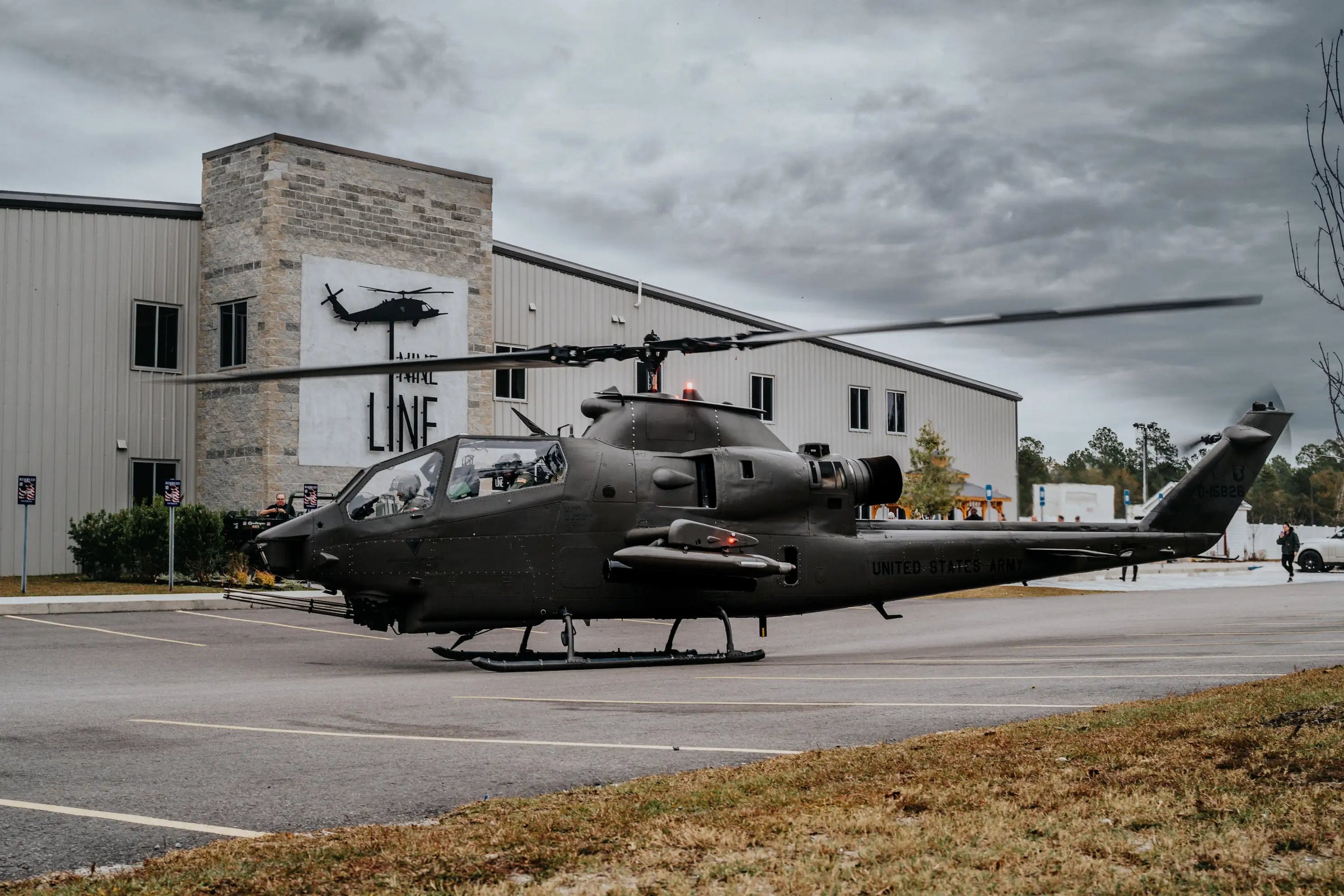 Black helicopter in front of Veteran-Owned patriotic clothing store, Nine Line Apparel HQ.