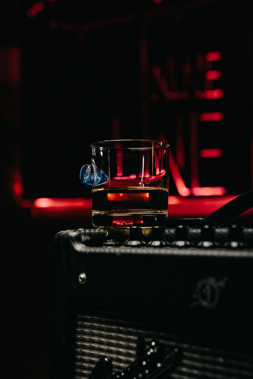 https://www.ninelineapparel.com/cdn/shop/products/american-made-whiskey-glass-with-embedded-guitar-pick-461952_1400x.jpg?v=1696351061